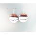 round flame painted and white copper enameled earrings with blackened sterling wire representing running wolves across snow